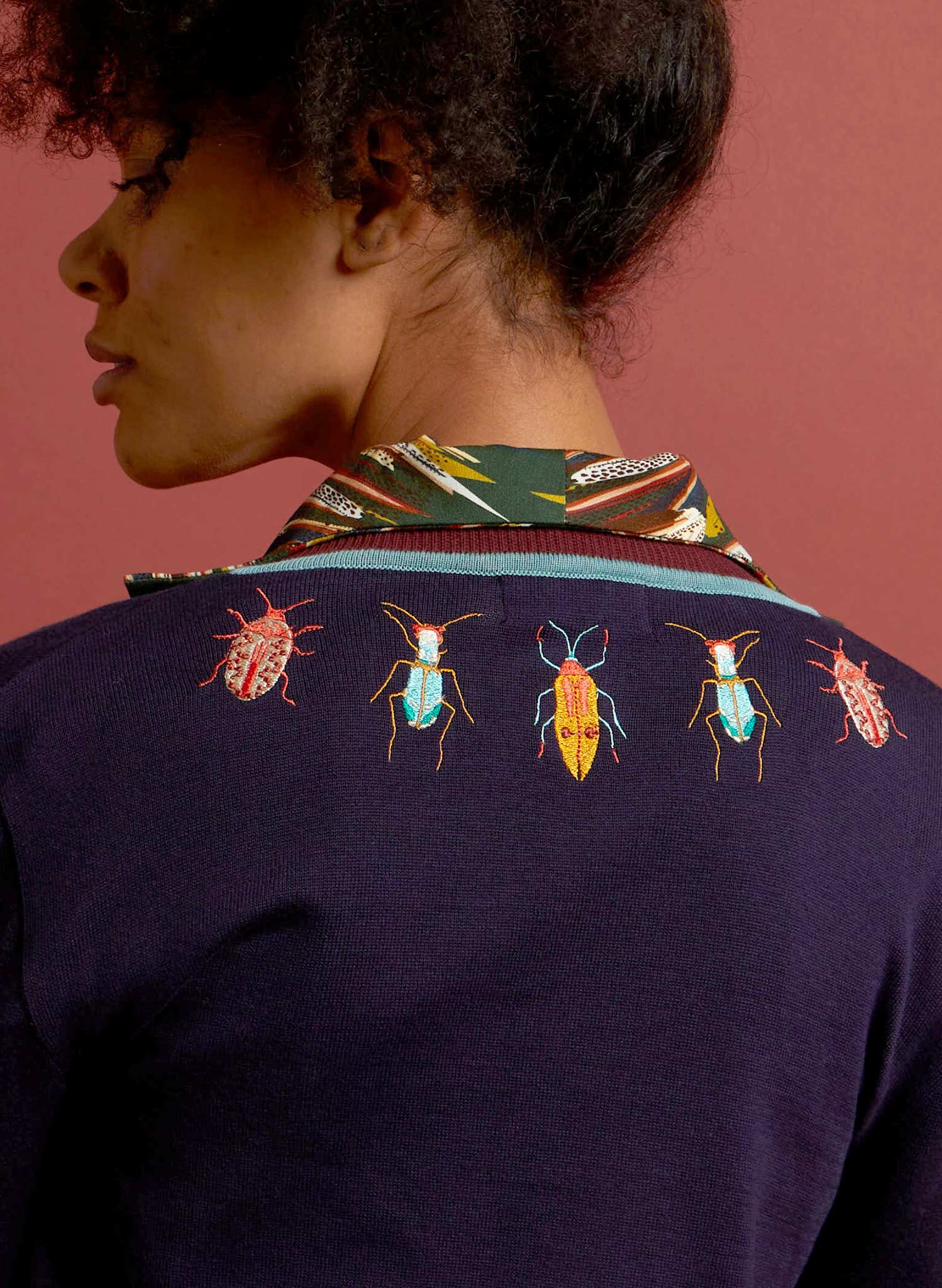 vintage style navy organic cotton knitted cardigan with brown and light blue trimmings and embroidered bugs