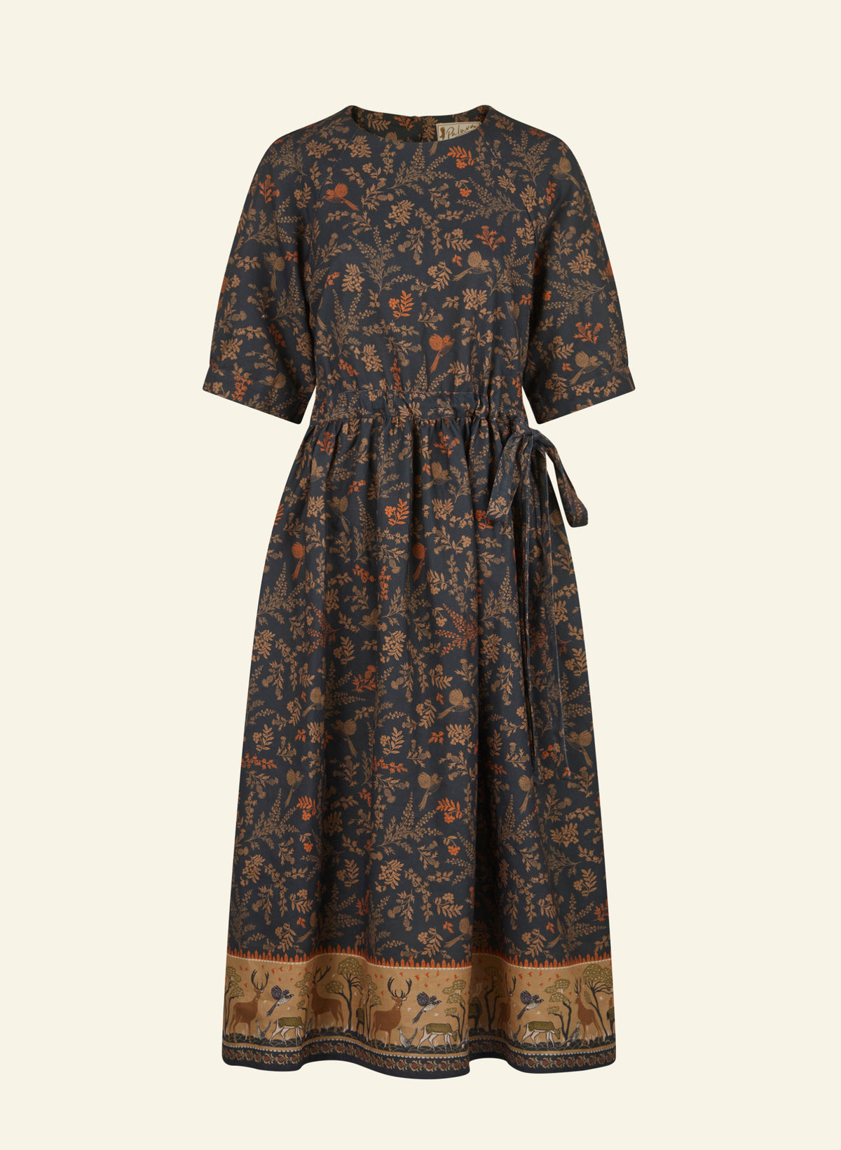 A dark navy blue midi dress with a dense orange and brown floral print, featuring short sleeves, a round neckline, a drawstring waist, and a decorative border with deer motifs at the bottom hem, shown against a solid off-white background.