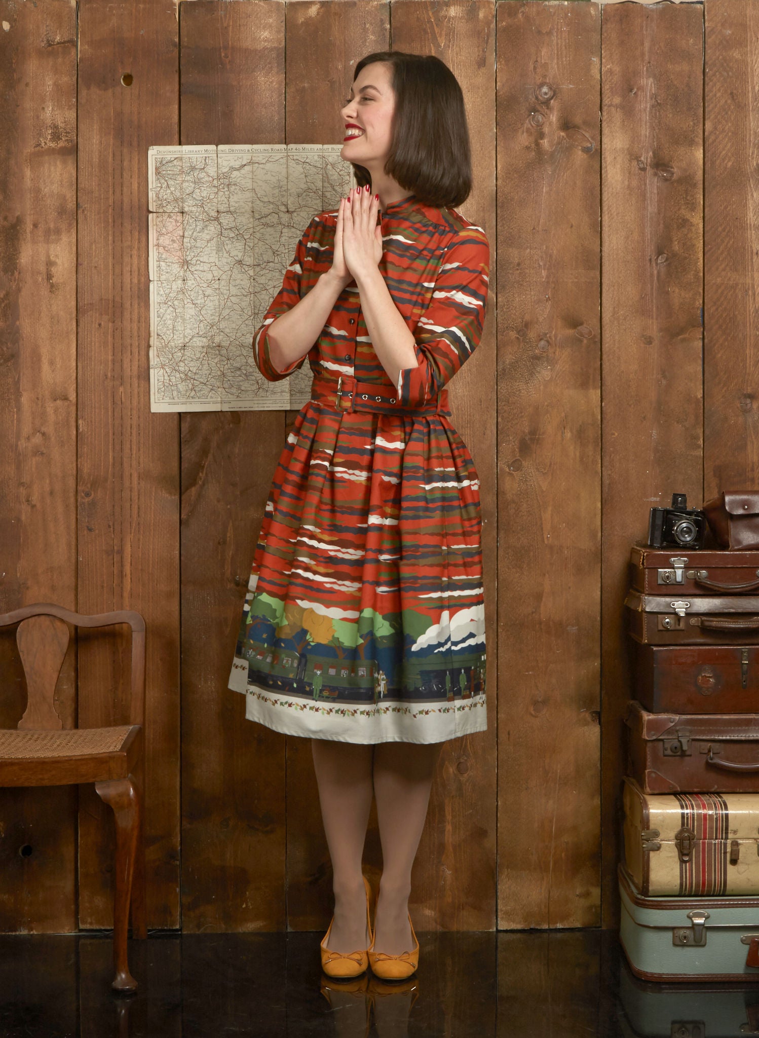 organic cotton, vintage-style, rust knee-length belted shirt dress with 3/4 length sleeves and flying Scotsman steam train print