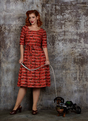 organic cotton, vintage-style, rust knee-length dress with tie-waist belt, pockets, and dachshund dog print