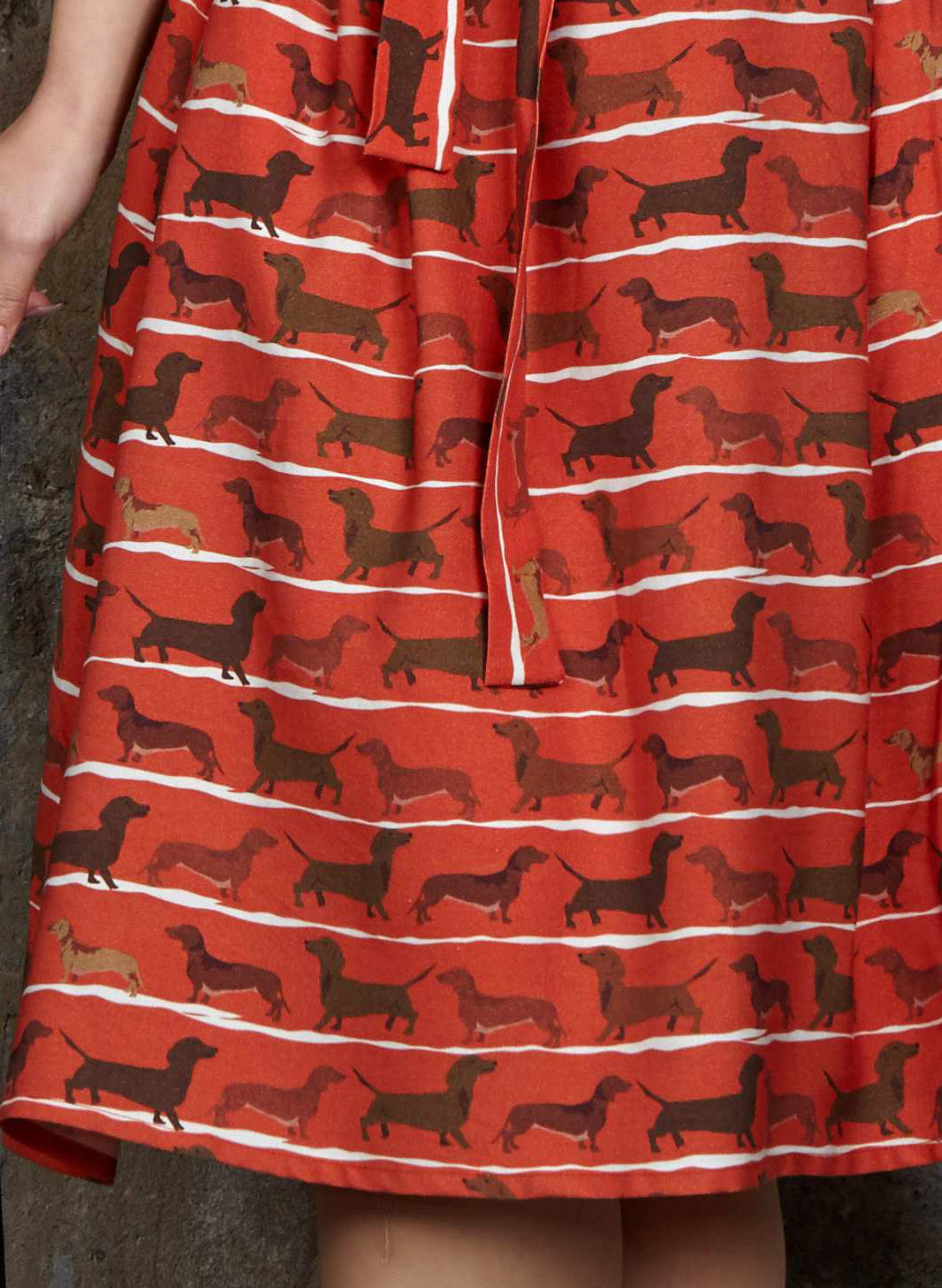 organic cotton, vintage-style, rust knee-length dress with tie-waist belt, pockets, and dachshund dog print