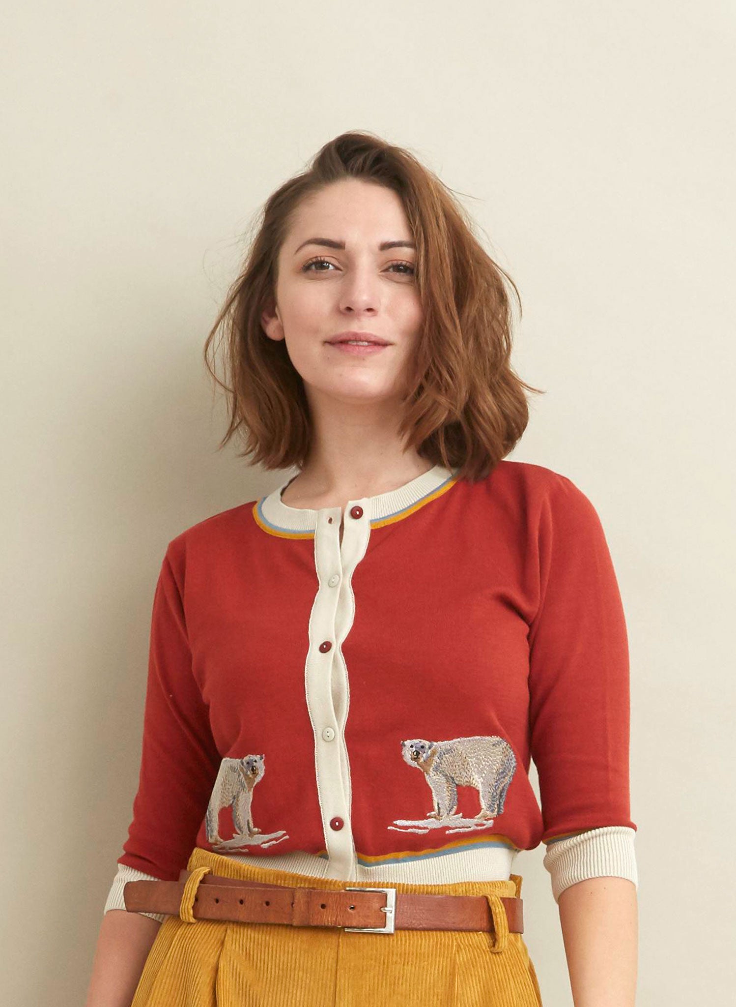 rust and white organic cotton knitted cardigan with two embroidered polar bears