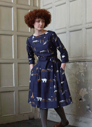 100% Tencel navy midi dress with tie-waist belt, 3/4 length sleeves, and endangered animals print