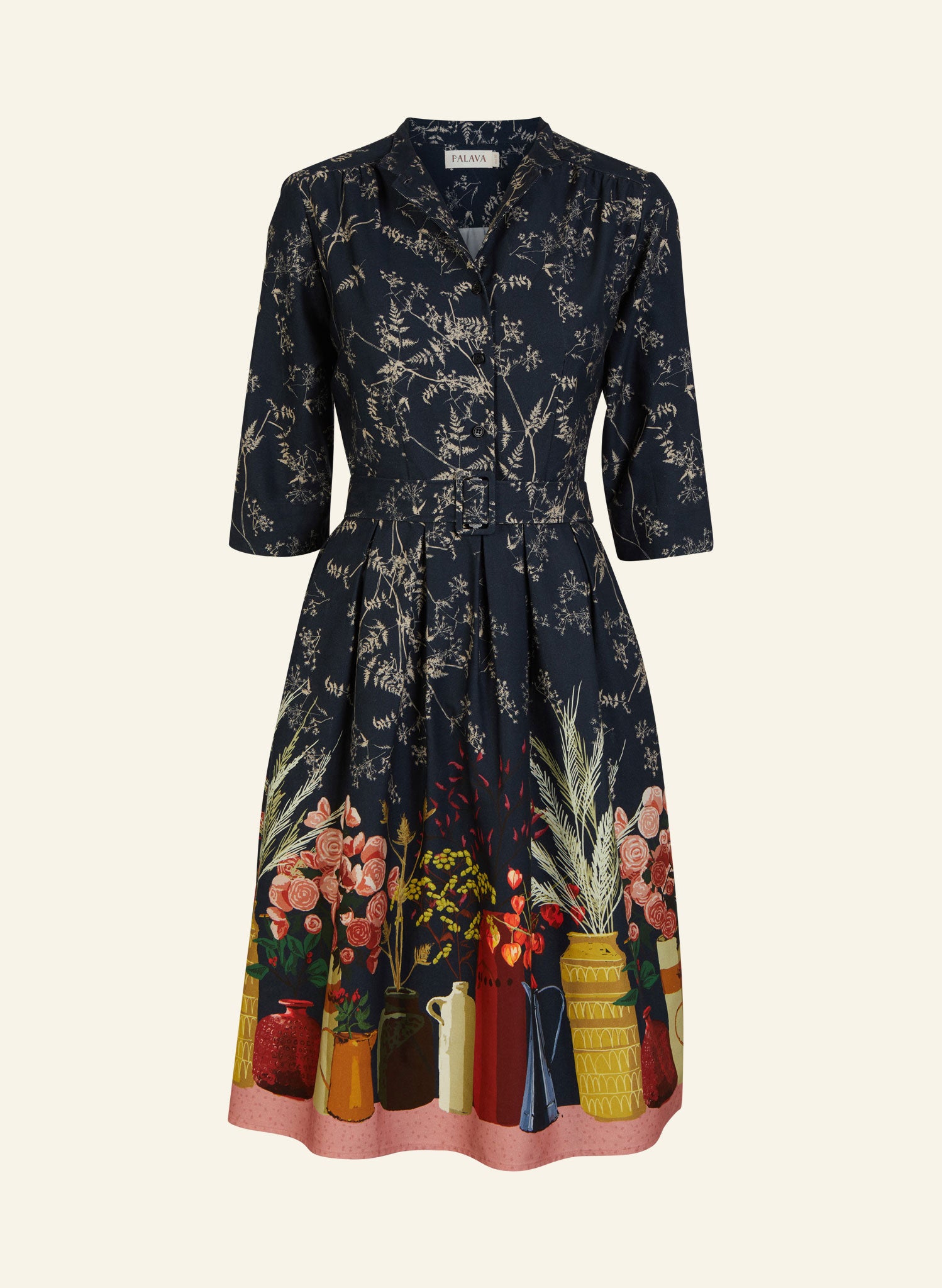 organic cotton navy knee-length belted shirt dress with 3/4 length sleeves, pockets, and a floral print