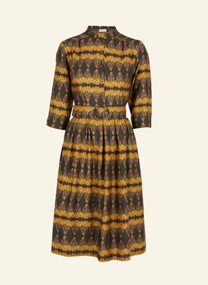 100% Tencel vintage-style gold and black knee-length belted shirt dress with 3/4 length sleeves, pockets, and a deco feather print