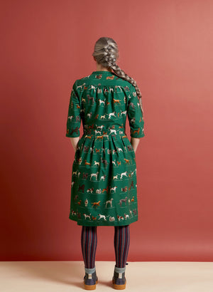 organic cotton vintage-style green knee-length belted shirt dress with 3/4 length sleeves, pockets, and green dogs print