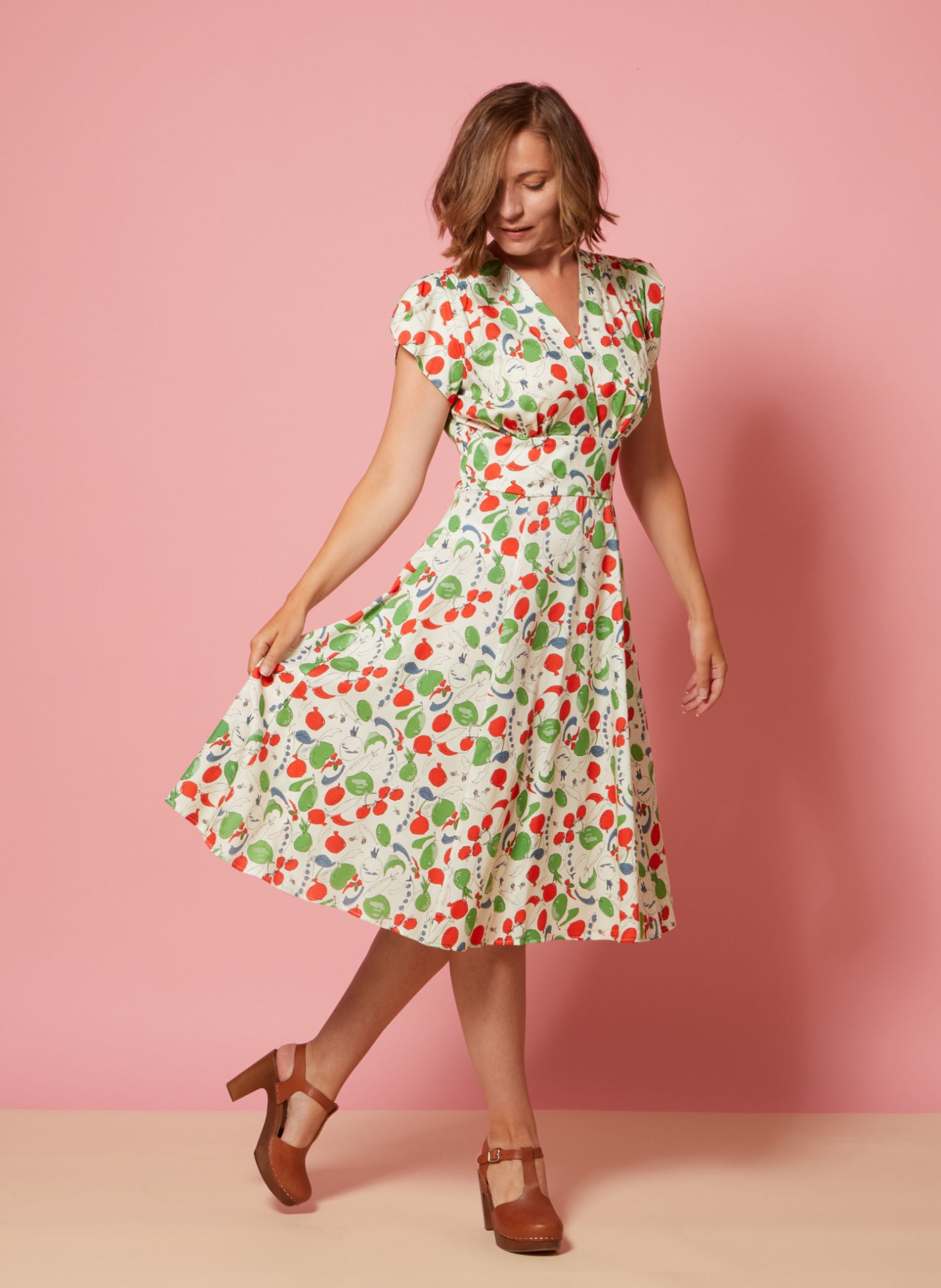 Cap sleeve 1940s style knee length summer dress with print of British garden vegetables