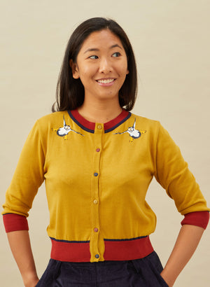 organic cotton knitted cardigan in mustard with red and navy trimmings and embroidered puffins