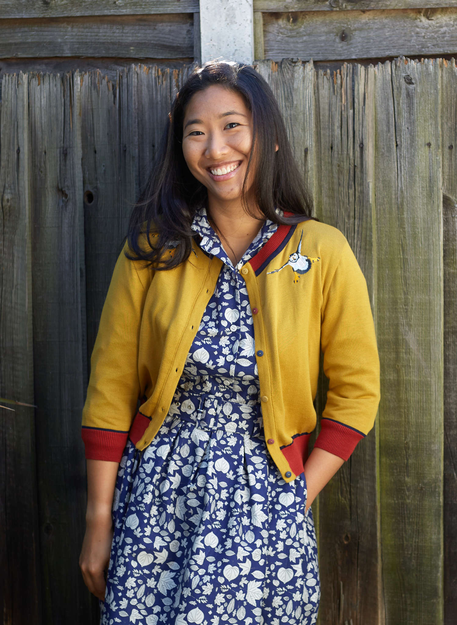 organic cotton knitted cardigan in mustard with red and navy trimmings and embroidered puffins