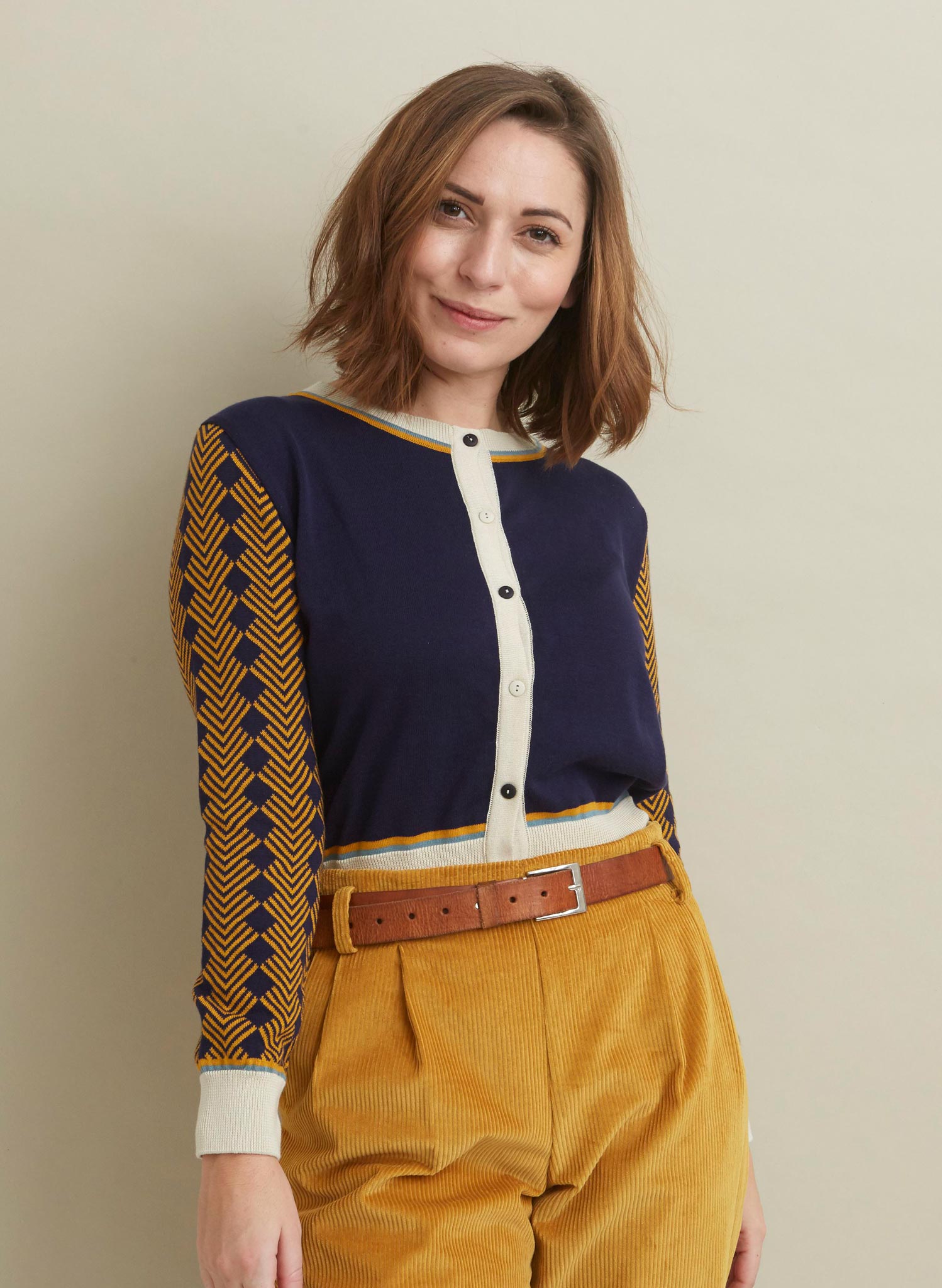 vintage style navy and mustard organic cotton jacquard knit cardigan with embroidered eagle in the back